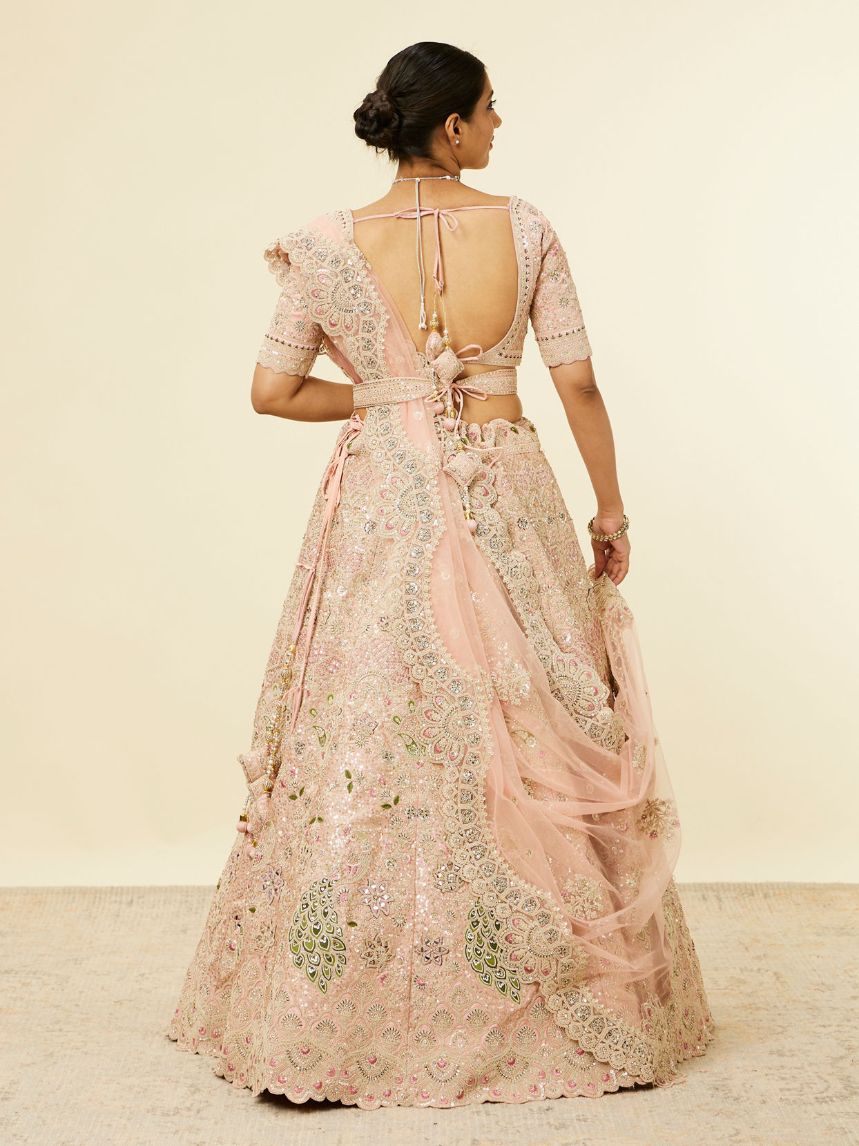 alt message - Mohey Women Golden Pink Sitara Embroidered Lehenga with Peacock Motifs image number 4